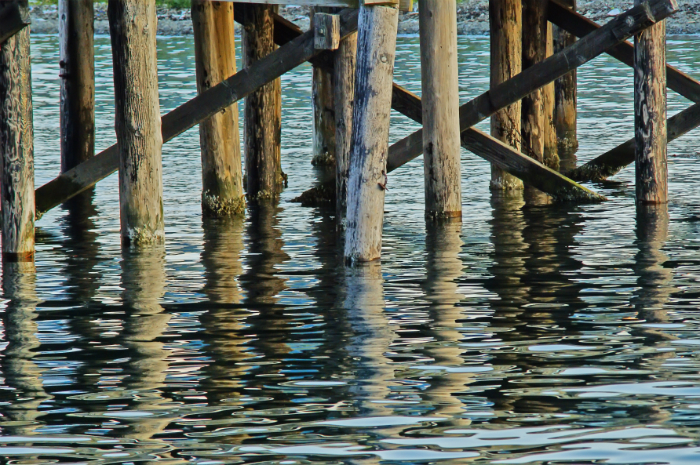 Deep South Marine Restoration team restoring dock pilings